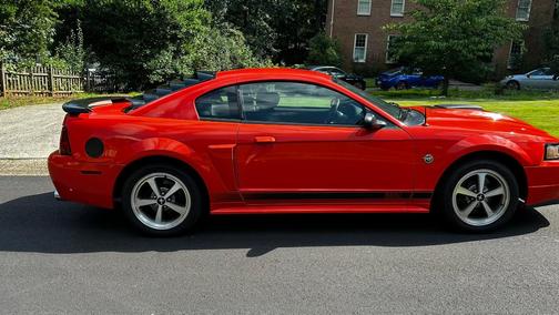 Orange 2004 Ford Mustang Mach I