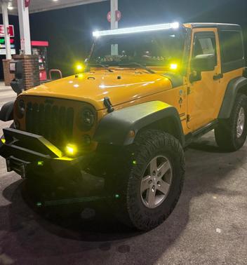 Yellow 2012 Jeep Wrangler Sport