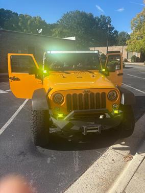 Yellow 2012 Jeep Wrangler Sport