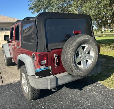 Red 2013 Jeep Wrangler Unlimited Sport