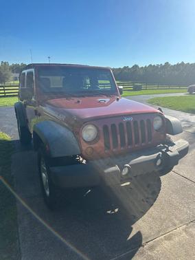 Red 2013 Jeep Wrangler Unlimited Sport