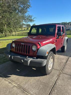 Red 2013 Jeep Wrangler Unlimited Sport