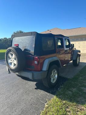 Red 2013 Jeep Wrangler Unlimited Sport