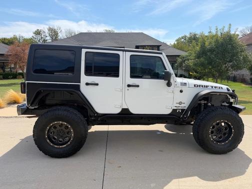White 2013 Jeep Wrangler Unlimited Freedom Edition