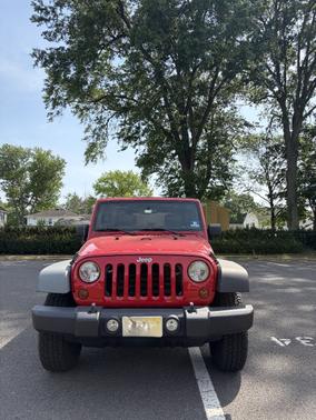 Red 2010 Jeep Wrangler Unlimited Rubicon