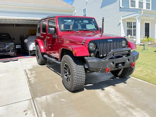 Red 2012 Jeep Wrangler Unlimited Freedom Edition