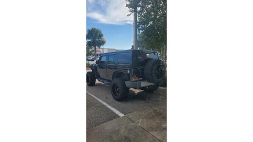 Black 2014 Jeep Wrangler Unlimited Sahara