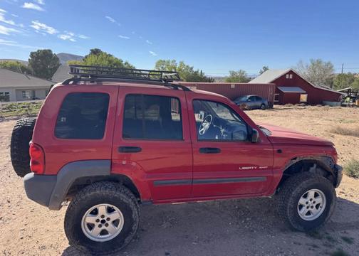 Red 2003 Jeep Liberty Sport