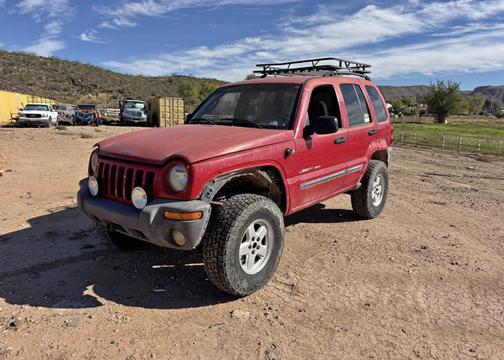 Red 2003 Jeep Liberty Sport