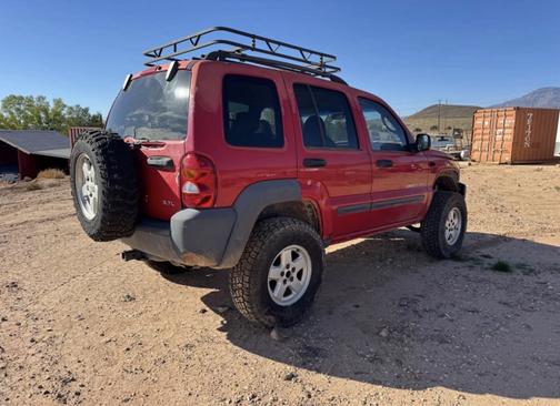 Red 2003 Jeep Liberty Sport