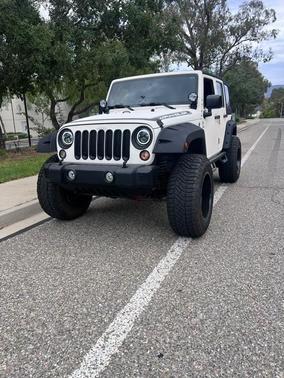 White 2015 Jeep Wrangler Unlimited Sport