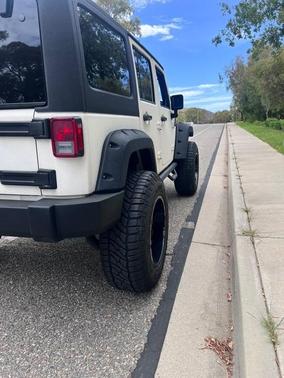 White 2015 Jeep Wrangler Unlimited Sport