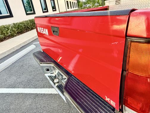Red 1995 Nissan Pickup Truck XE