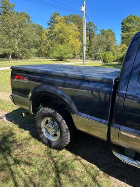 Blue 2003 Ford F-250 Lariat SuperCab Super Duty