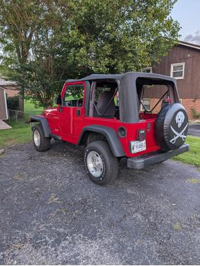Red 1997 Jeep Wrangler SE
