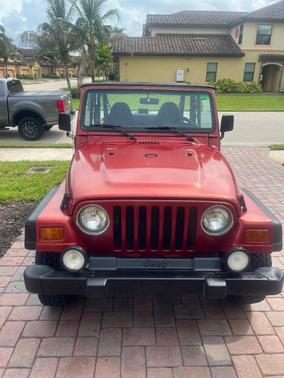 Red 1998 Jeep Wrangler Sport