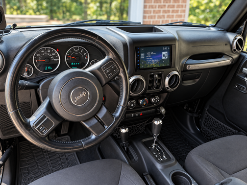 Black 2015 Jeep Wrangler Unlimited Sport