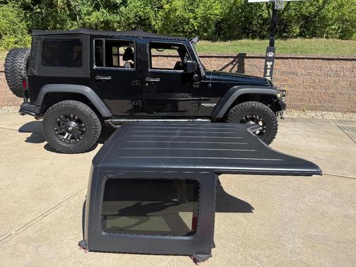Black 2015 Jeep Wrangler Unlimited Sport
