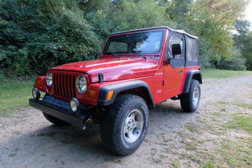 Red 1999 Jeep Wrangler Sport