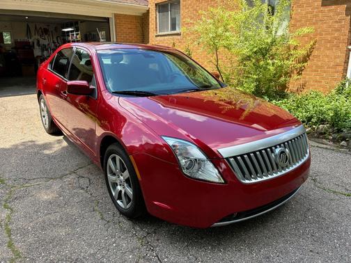 Red 2011 Mercury Milan Premier