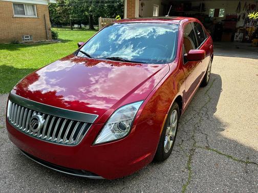 Red 2011 Mercury Milan Premier