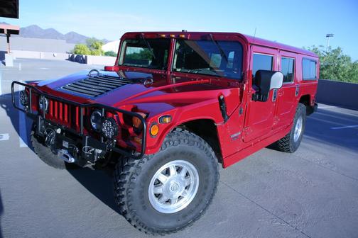 Red 1998 AM General Hummer Wagon