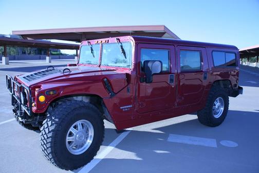 Red 1998 AM General Hummer Wagon