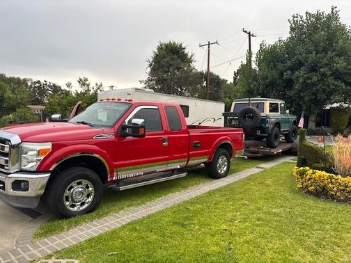 Red 2012 Ford F-250 Lariat