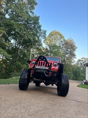 Red 2014 Jeep Wrangler Unlimited Rubicon