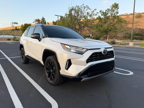 White 2023 Toyota RAV4 Hybrid XSE