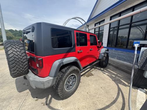 Red 2009 Jeep Wrangler Unlimited X