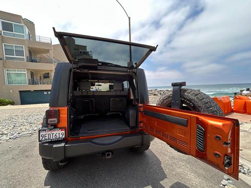 Orange 2010 Jeep Wrangler Unlimited Sport