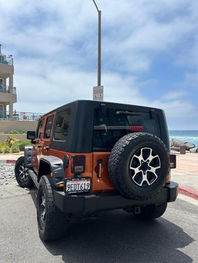 Orange 2010 Jeep Wrangler Unlimited Sport