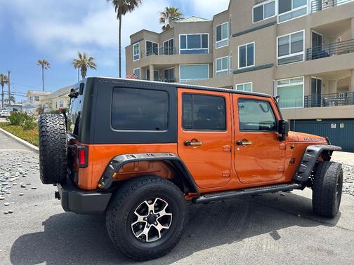 Orange 2010 Jeep Wrangler Unlimited Sport