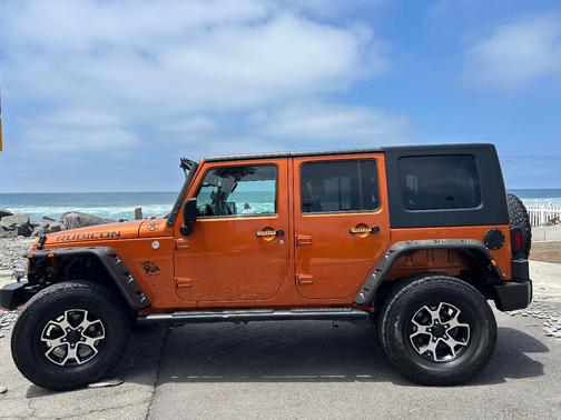 Orange 2010 Jeep Wrangler Unlimited Sport
