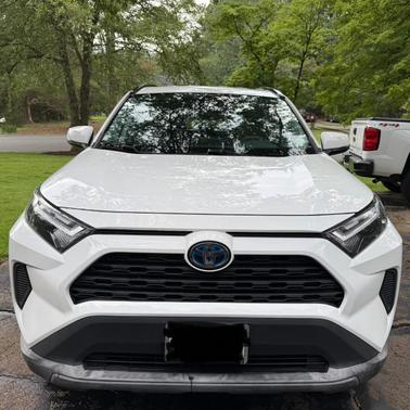 White 2023 Toyota RAV4 Hybrid LE
