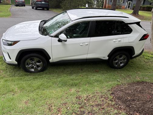 White 2023 Toyota RAV4 Hybrid LE