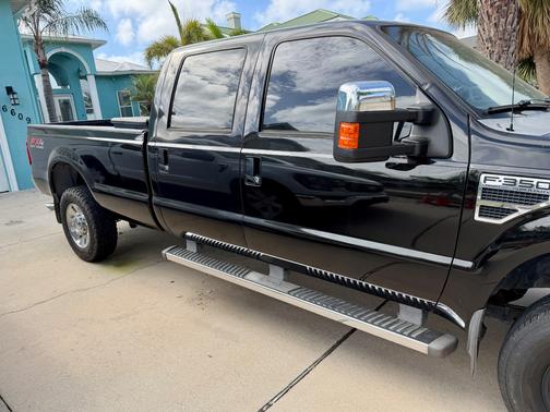 Black 2010 Ford F-350 Lariat Super Duty Crew Cab