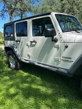 White 2010 Jeep Wrangler Unlimited Sport