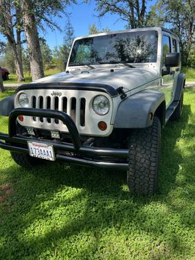 White 2010 Jeep Wrangler Unlimited Sport