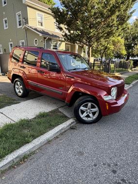 Red 2009 Jeep Liberty Sport
