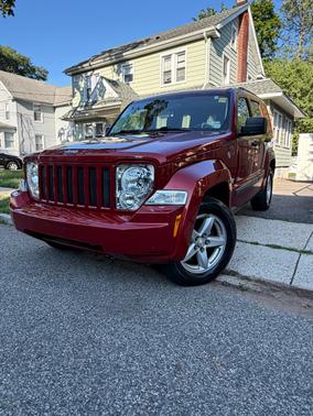 Red 2009 Jeep Liberty Sport