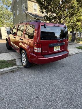 Red 2009 Jeep Liberty Sport