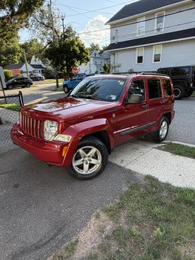Red 2009 Jeep Liberty Sport