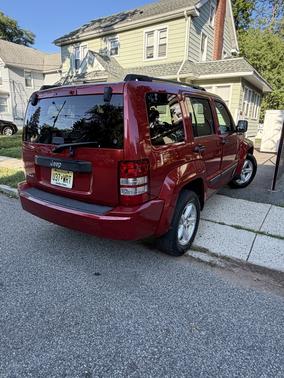 Red 2009 Jeep Liberty Sport