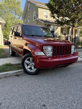 Red 2009 Jeep Liberty Sport