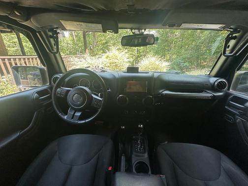Black 2016 Jeep Wrangler Unlimited Sport