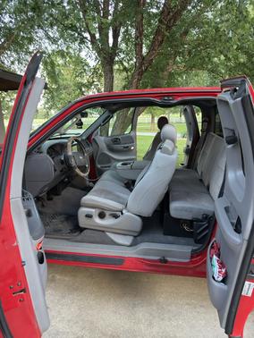 Red 2003 Ford F-150 XLT SuperCab