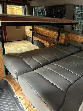 Red 1999 Ford E150 Base