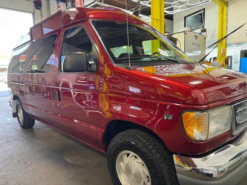 Red 1999 Ford E150 Base